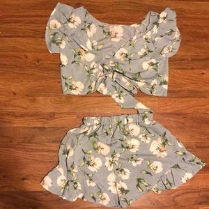 Cute crop top and high waisted bottom .